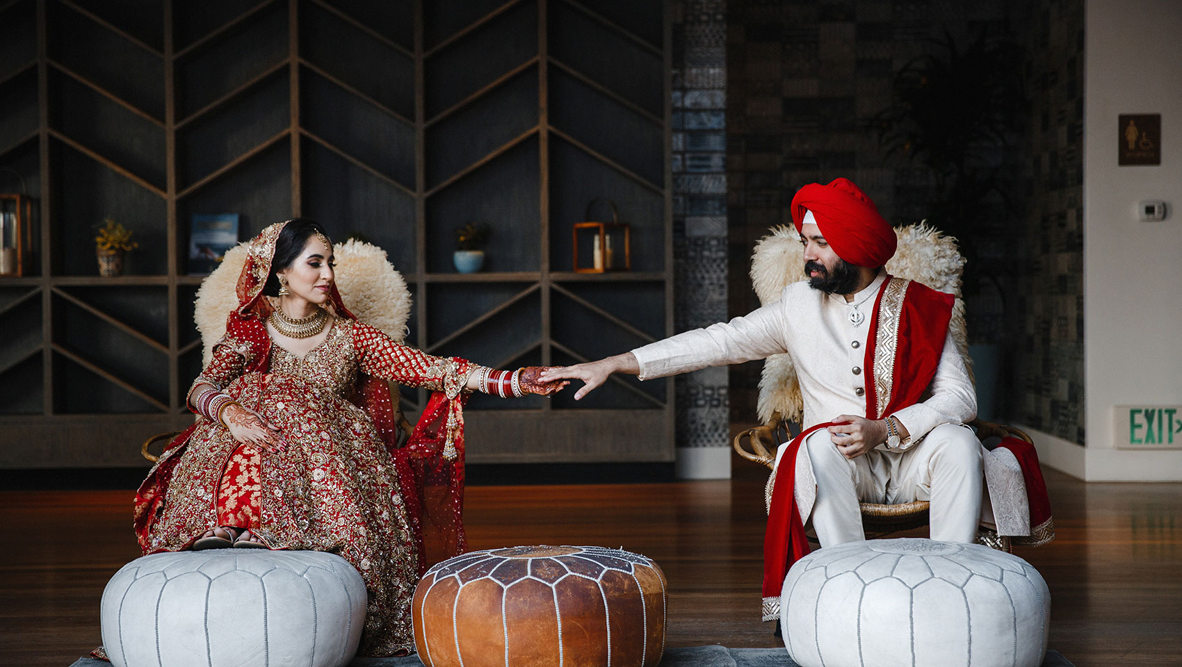 bungalow terrace set for a cocktail reception with pink linens and a bar. 